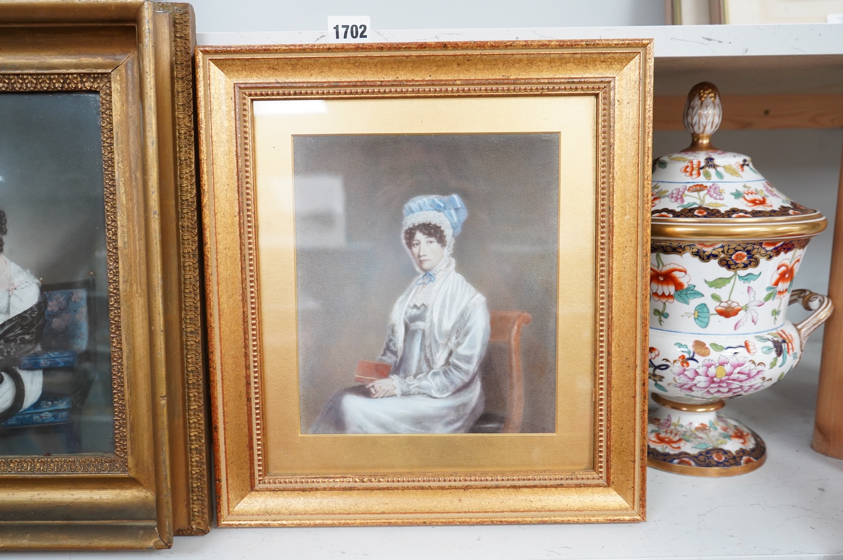 Regency School, Portraits of seated ladies, unsigned, two watercolours on card, largest 26 x 21cm, each gilt framed